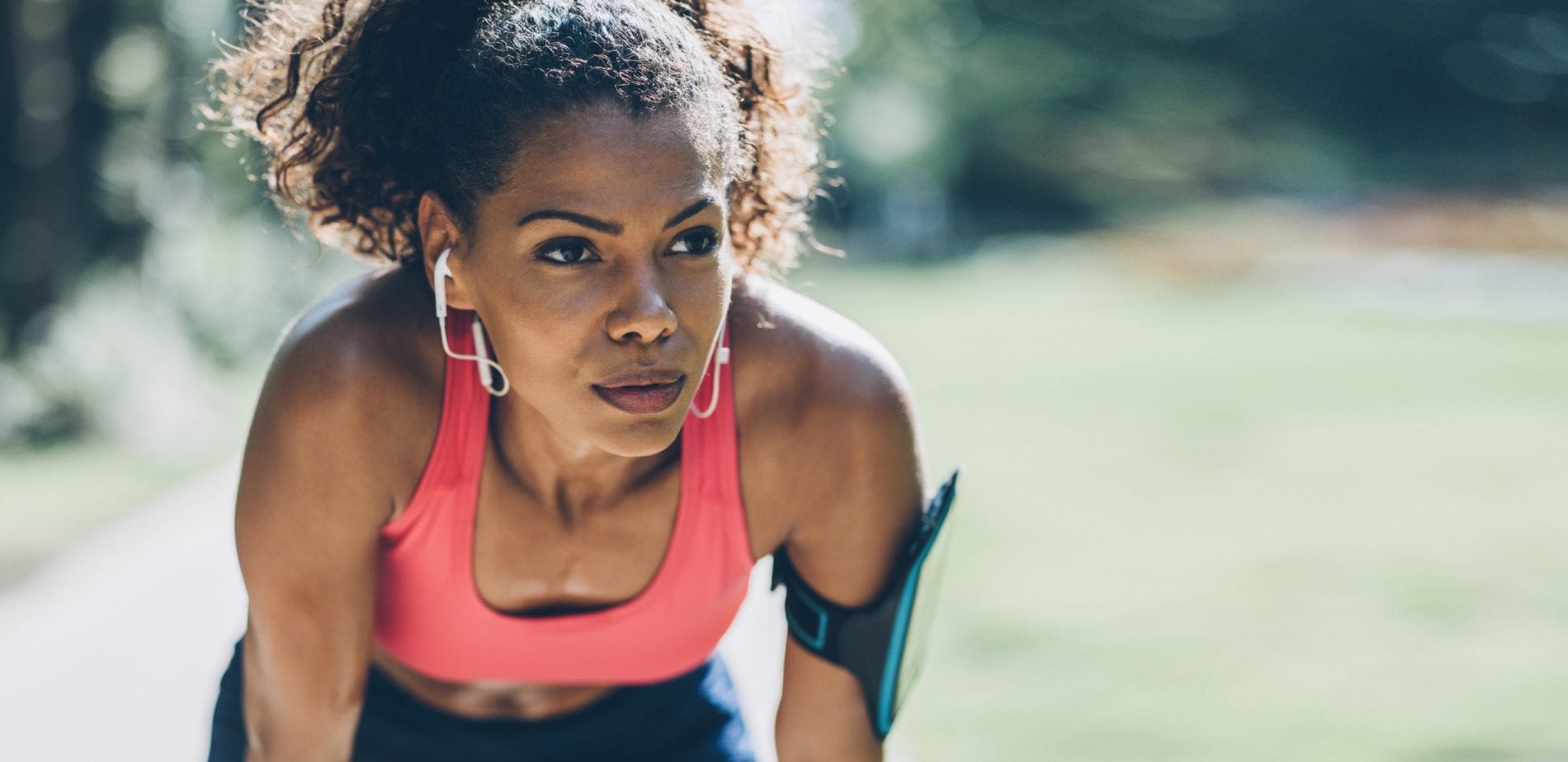 Women bent over breathing during a run